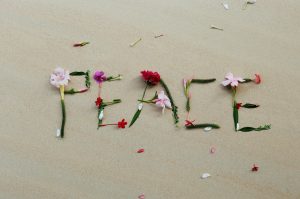 peace spelled out in flowers