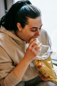 woman eating hamburger